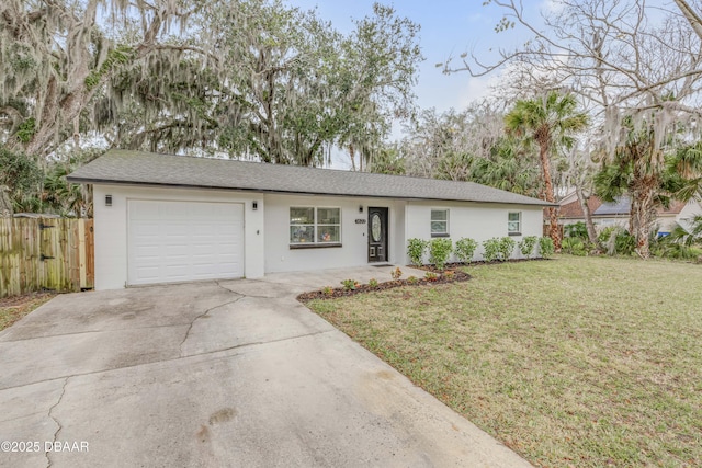 ranch-style home featuring a garage and a front yard