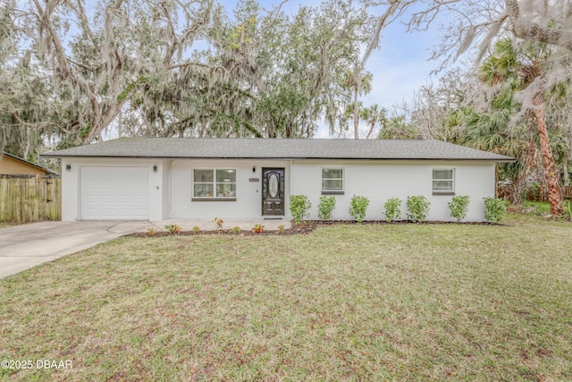 ranch-style home featuring a garage and a front yard