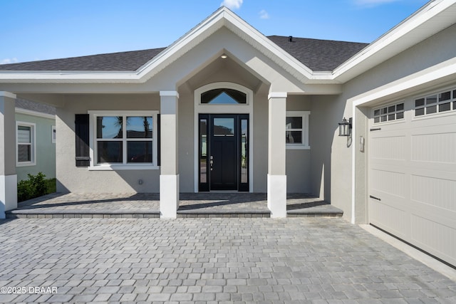 entrance to property featuring a garage