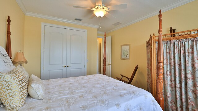 bedroom featuring ceiling fan, a closet, and crown molding