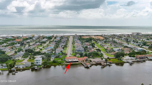 birds eye view of property featuring a water view