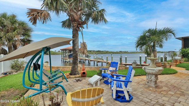 view of patio / terrace featuring a water view and a boat dock