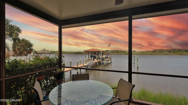 exterior space featuring a water view and a dock