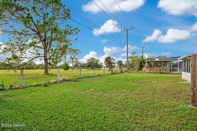 view of yard featuring a sunroom