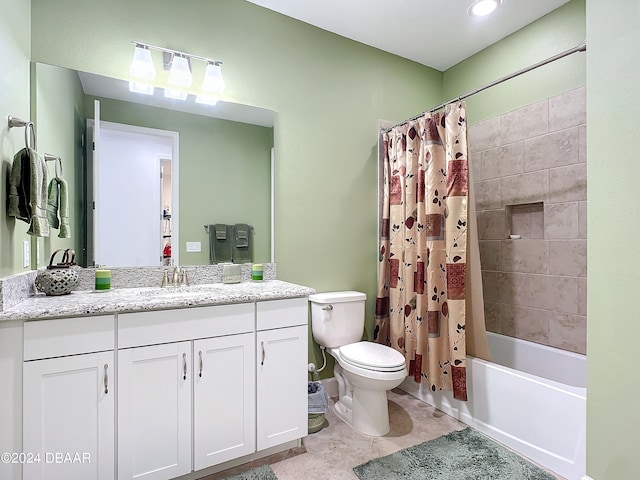 full bathroom with tile patterned floors, vanity, shower / tub combo, and toilet