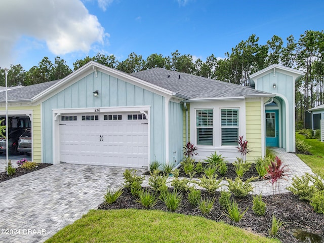 ranch-style house featuring a garage