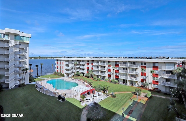 view of swimming pool featuring a water view