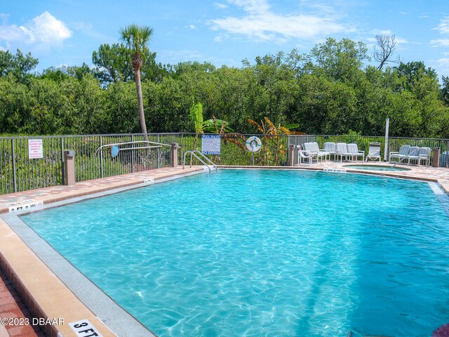 520 S Peninsula Ave Unit 2D7, New Smyrna Beach, FL 32169 - view of swimming pool featuring a patio area