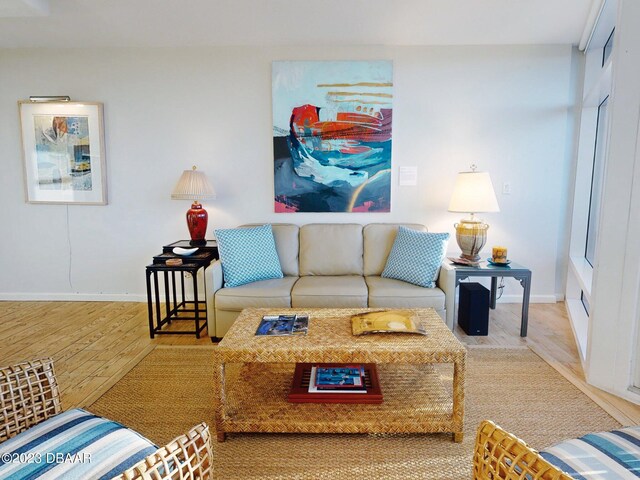 520 S Peninsula Ave Unit 2D7, New Smyrna Beach, FL 32169 - living room featuring hardwood / wood-style flooring