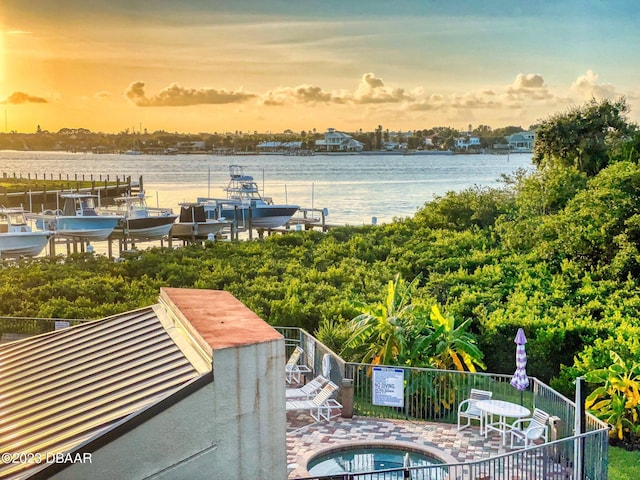 520 S Peninsula Ave Unit 2D7, New Smyrna Beach, FL 32169 - water view featuring a dock