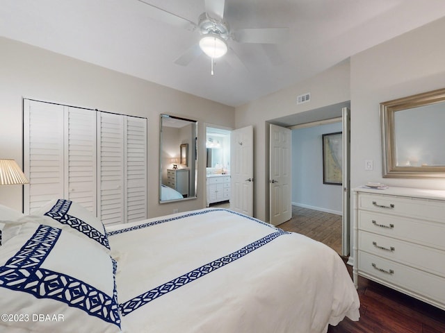 520 S Peninsula Ave Unit 2D7, New Smyrna Beach, FL 32169 - bedroom featuring ensuite bathroom, ceiling fan, dark hardwood / wood-style floors, and a closet