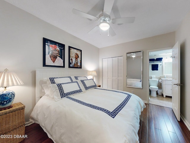 520 S Peninsula Ave Unit 2D7, New Smyrna Beach, FL 32169 - bedroom with dark hardwood / wood-style flooring, a closet, ceiling fan, and ensuite bathroom