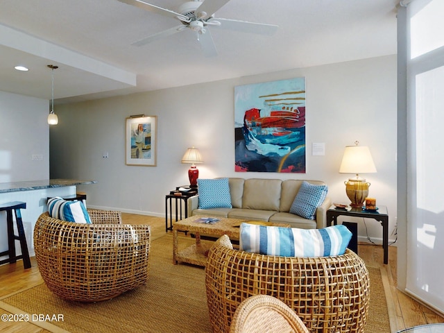 520 S Peninsula Ave Unit 2D7, New Smyrna Beach, FL 32169 - living room featuring light wood-type flooring and ceiling fan