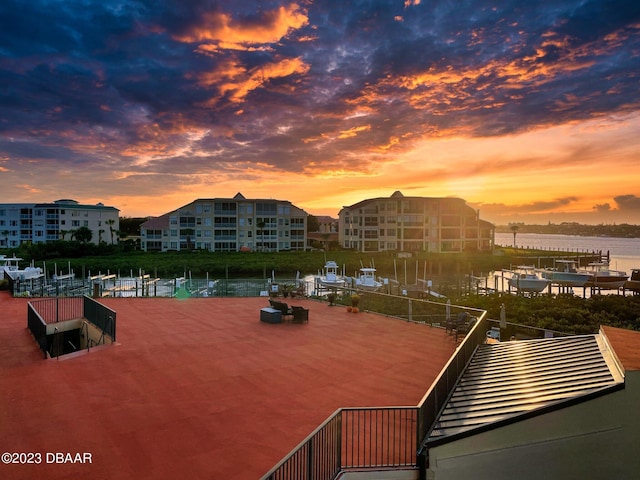 520 S Peninsula Ave Unit 2D7, New Smyrna Beach, FL 32169 - patio terrace at dusk with a water view