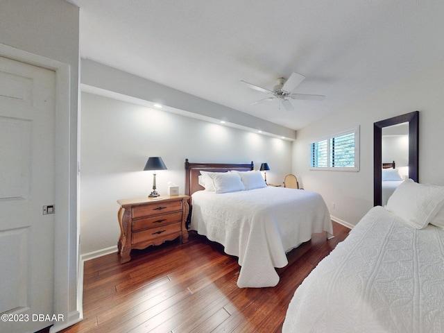 520 S Peninsula Ave Unit 2D7, New Smyrna Beach, FL 32169 - bedroom featuring dark hardwood / wood-style flooring and ceiling fan