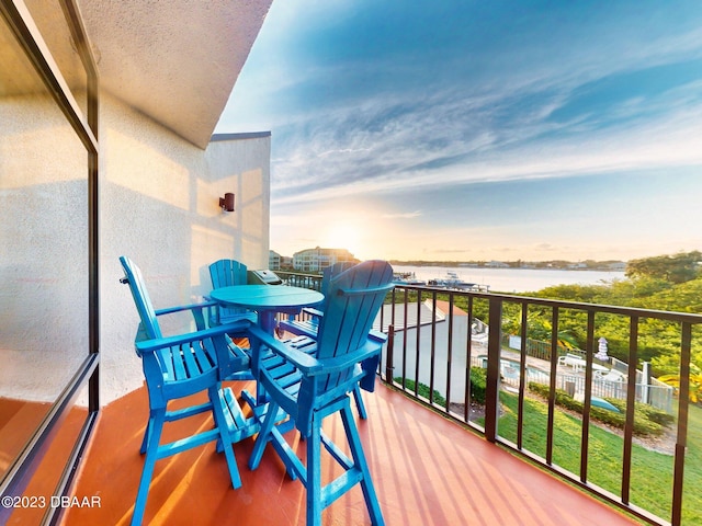 balcony at dusk with a water view