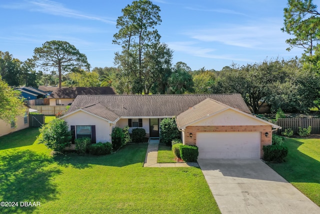 single story home featuring a garage and a front lawn