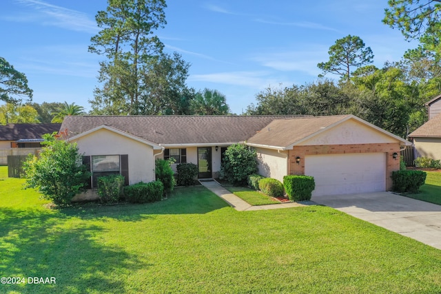 single story home featuring a garage and a front lawn