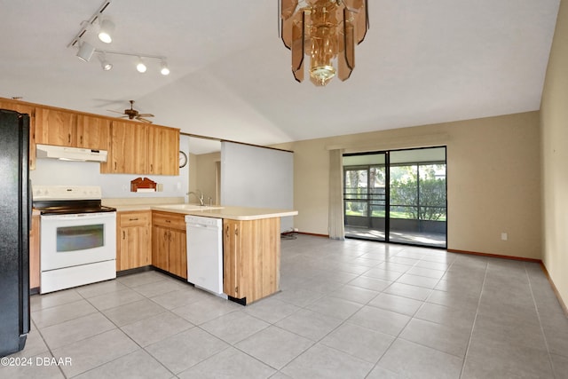 kitchen with kitchen peninsula, ceiling fan, light tile patterned floors, white appliances, and vaulted ceiling