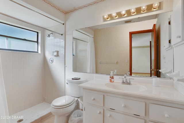 bathroom featuring curtained shower, vanity, and toilet