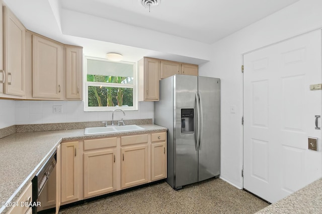 kitchen featuring light brown cabinets, stainless steel appliances, and sink