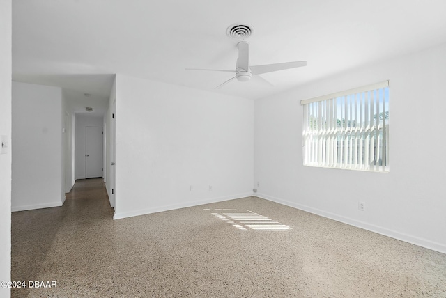 unfurnished room with ceiling fan