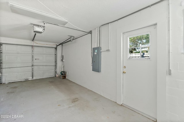 garage featuring electric panel and a garage door opener