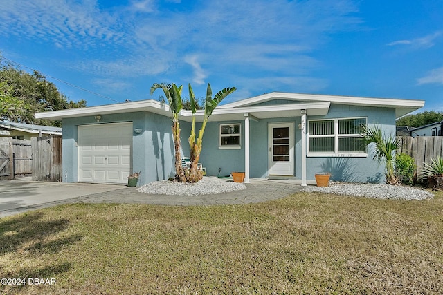 view of front facade featuring a garage and a front yard