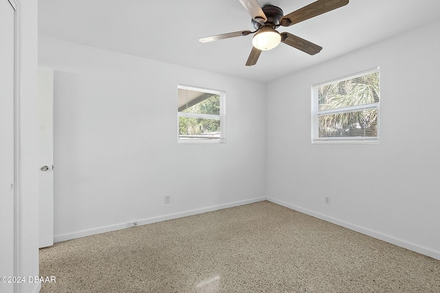 empty room featuring ceiling fan