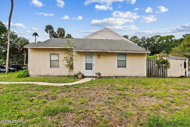 ranch-style home with a front lawn