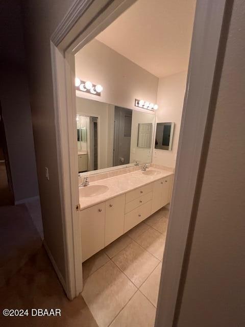 bathroom featuring tile patterned flooring, vanity, and toilet