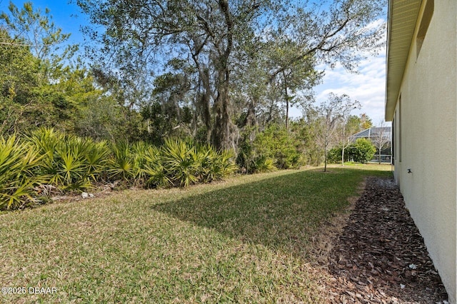 view of yard featuring a lanai