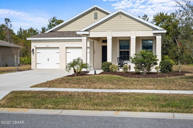 view of front of home featuring a porch, an attached garage, concrete driveway, roof with shingles, and stucco siding