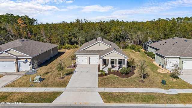 aerial view featuring a wooded view