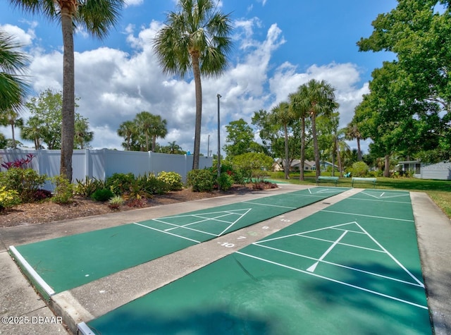 surrounding community featuring shuffleboard and fence