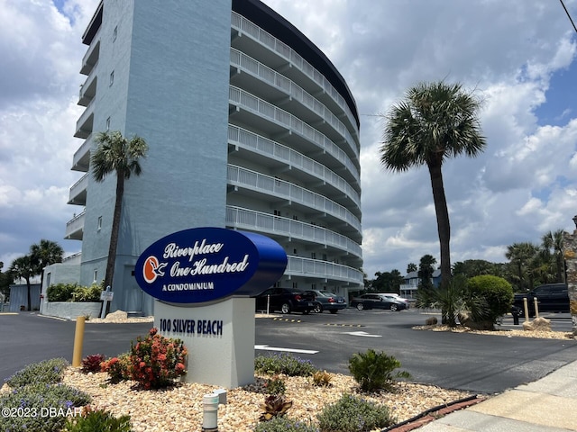 view of property featuring uncovered parking