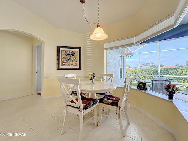 dining space with tile patterned floors