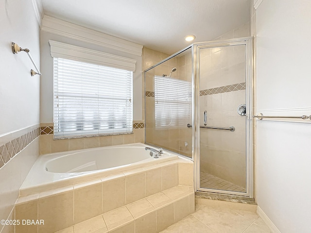 bathroom featuring tile patterned flooring and independent shower and bath