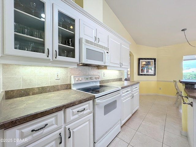 kitchen featuring white appliances and white cabinetry