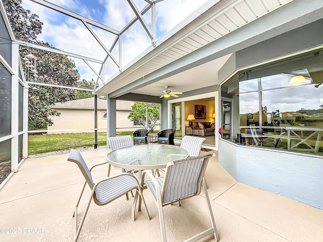 view of patio with ceiling fan and a lanai