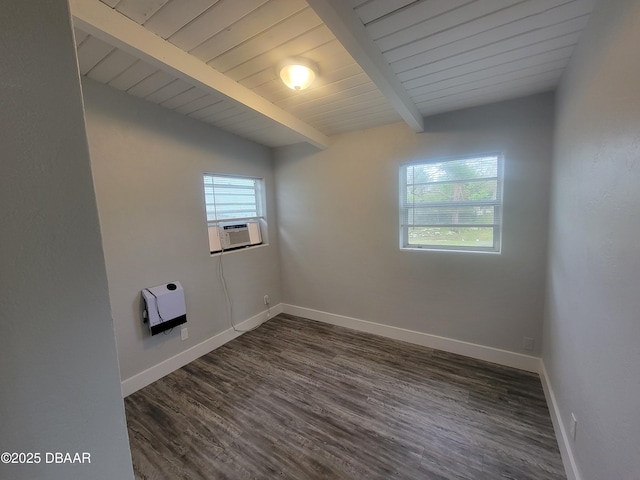 empty room featuring baseboards, dark wood-style floors, beamed ceiling, heating unit, and cooling unit