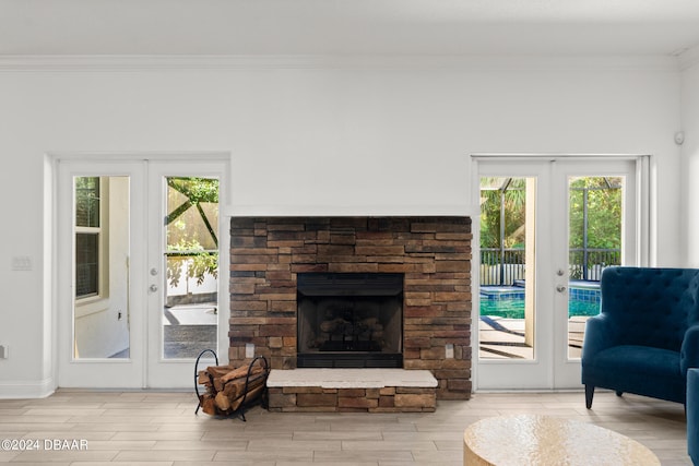 living room with french doors and ornamental molding