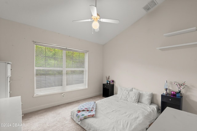 carpeted bedroom featuring ceiling fan and vaulted ceiling