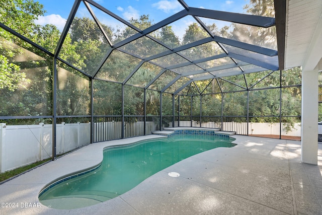 view of pool featuring a lanai and a patio