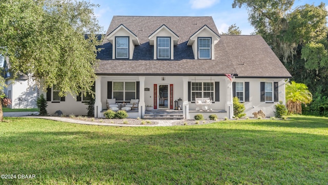 cape cod house with a porch and a front yard