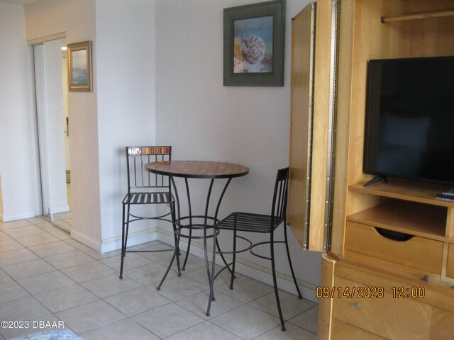 dining area with light tile patterned floors