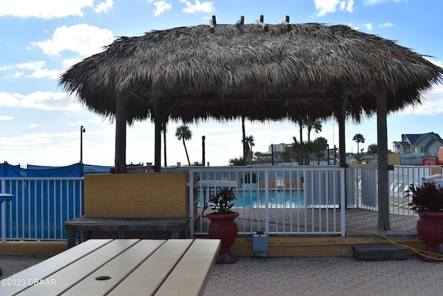 view of swimming pool with a water view