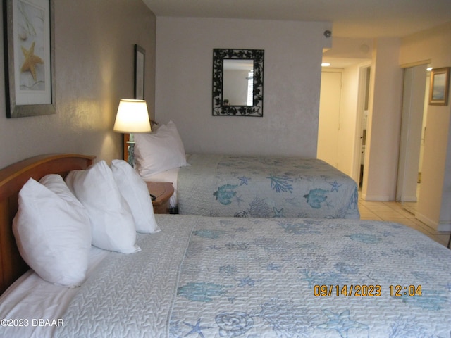 bedroom featuring light tile patterned floors