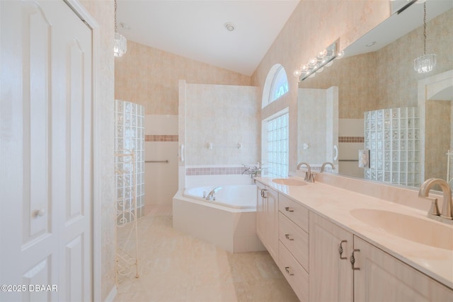 bathroom with tile patterned flooring, vanity, independent shower and bath, and tile walls