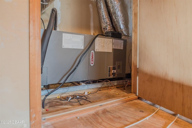 utility room with heating unit